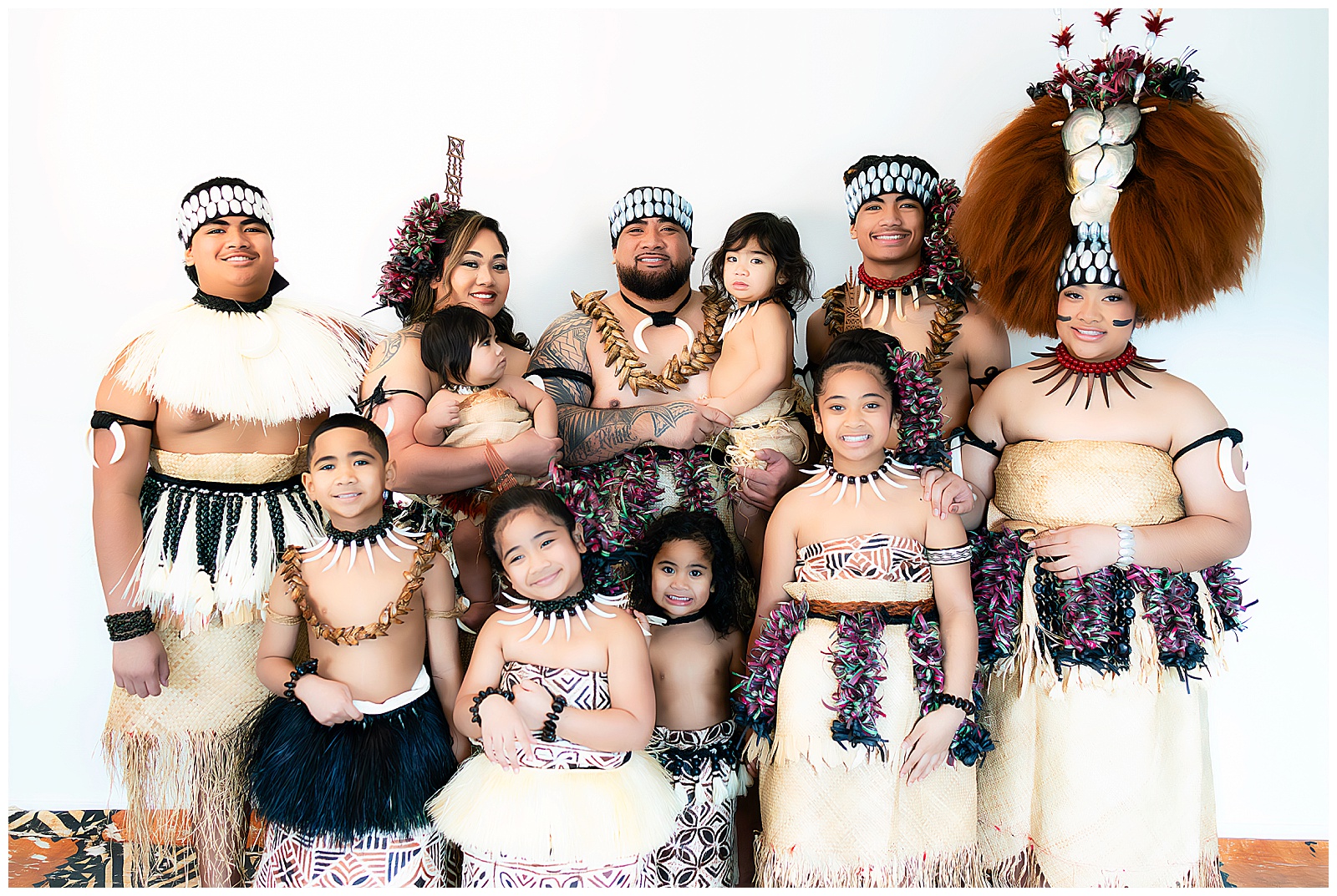 family photo dressed in Samoan outfits